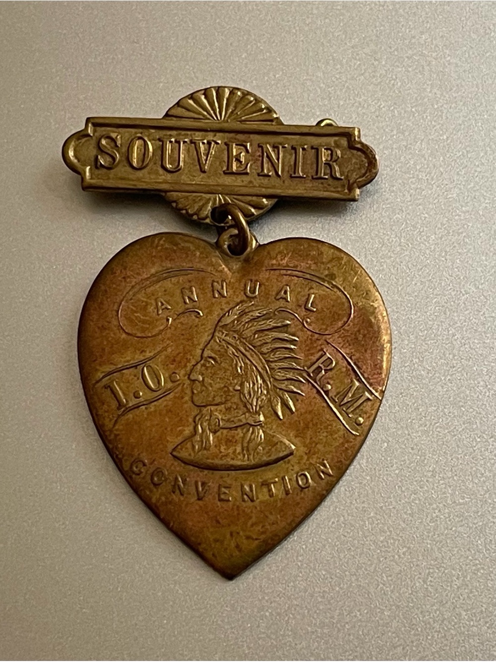 Antique Brooch  Heart Drop the profile of a Native American chief.